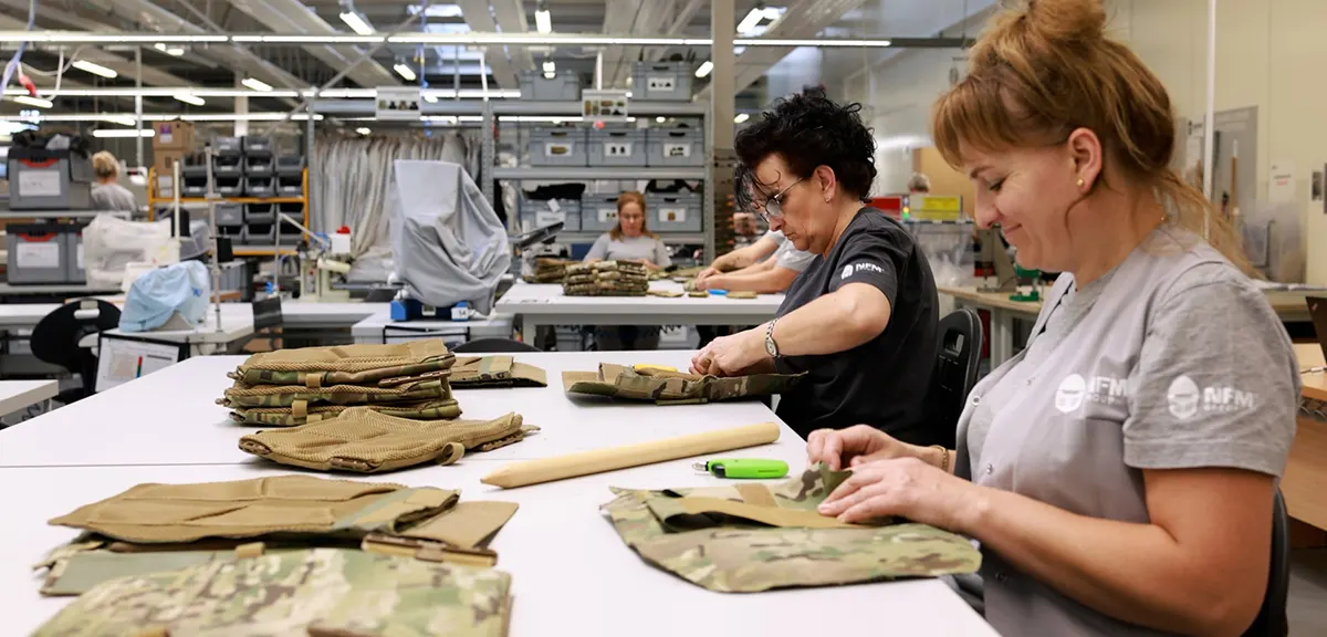 Employees assembling ballistic plates in NFM Production in Lębork, Poland